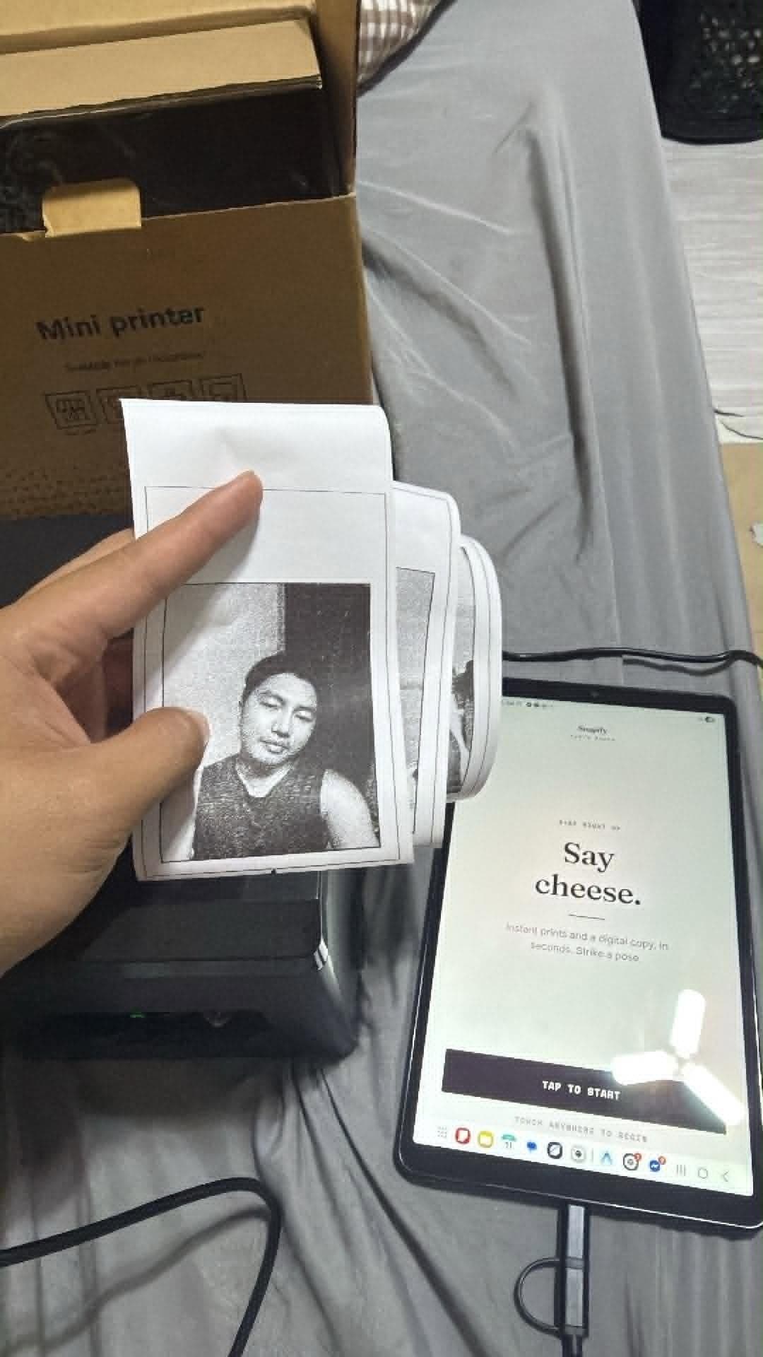 Snapify kiosk in the wild — tablet, 80mm thermal printer, and a fresh thermal print